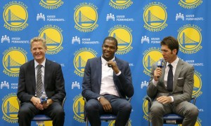 July 07, 2016 Oakland, CA: New Golden State Warriors forward Kevin Durant is introduced after signing a two-year, $54.3 million contract during a press conference at the teams practice facility in Oakland, CA. Coach Steve Kerr is on the left and General Manager Bob Myers on the right. (Photograph by Daniel Gluskoter/Icon Sportswire)